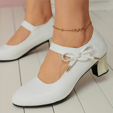 Chic Mid-Heel Buckle Pumps by Sophie Laurie